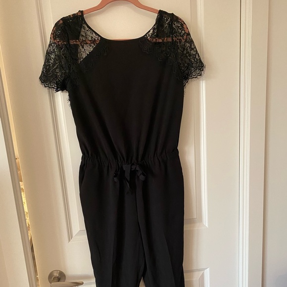 Never worn, black jumpsuit with lace sleeves - Picture 2 of 3